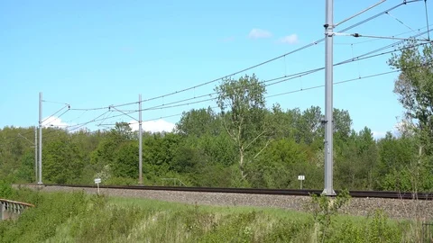 Modern dutch train passing in full speed Stock Footage 89408570