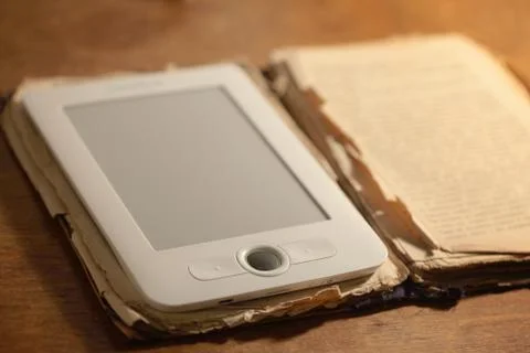Modern e-book and old paper book Stock Photos