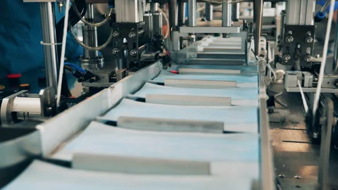 Modern earloop attaching machine in action. Coronavirus protection mask Stock Footage 142920591