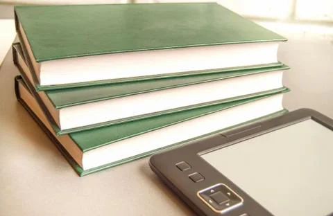 Modern educational technologies, e-book next to a stack of books, the concept Foto stock