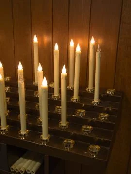 Modern electric candles, to avoid fire risk  in the church Stock Photos