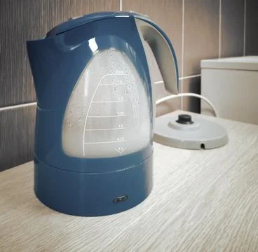 Modern electric kettle on the kitchen table Stock Photos