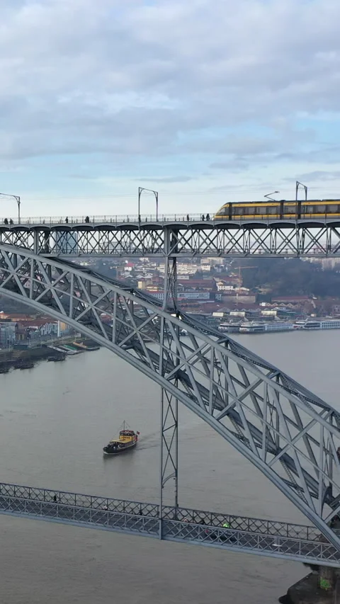 Modern Electric Metro Train on Ponte Luis I Bridge in Porto, Portugal, Europe Stock Footage 256073343