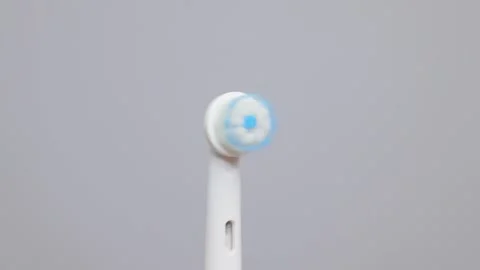 Modern electric toothbrush isolated over gray background. Controlled tool for Stockbeeldmateriaal 261302043