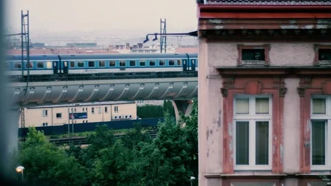 Modern electric train on a viaduct. Train on Railway in Prague Suburbia. Stock Footage 162988087
