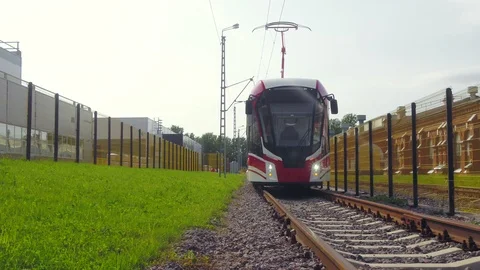 A modern electric tram on the rails Stock Footage 99363568