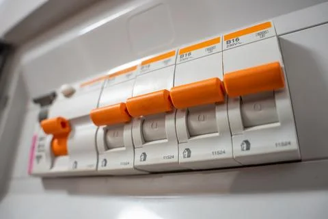 Modern electrical circuit breakers and switches on the wall. Foto stock
