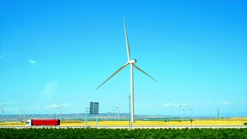 Modern Electricity generation with  Eólica on field, View from a car window Stock Footage 201190328