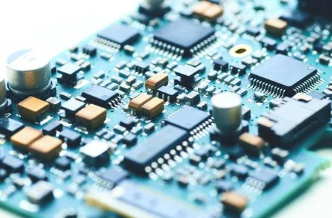 Modern electronic board with microchips and electronic parts Stock Photos