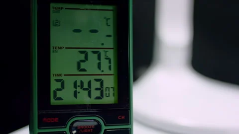 Modern electronic clock displays evening time on screen Stock Footage 246666565