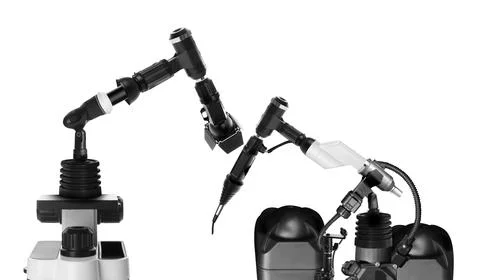 Modern electronic laboratory robot manipulators on white background. Machine  Stock Photos