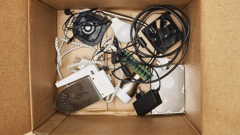 Modern electronic waste in cardboard box. 4K stop motion animation seamless loop Stock Footage 124702769