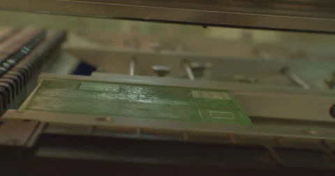Modern electronics manufacturing equipment makes a complex printed circuit board Stock Footage 152780933