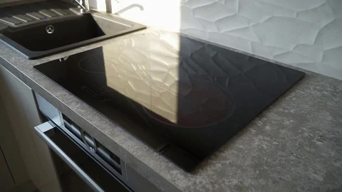 Modern elegant glass electric platform stove in a brand new kitchen real Stock Footage 101683350