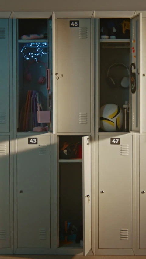 Modern Elementary School Corridor with Open Lockers Revealing Everyday Student Stock Footage 342023145