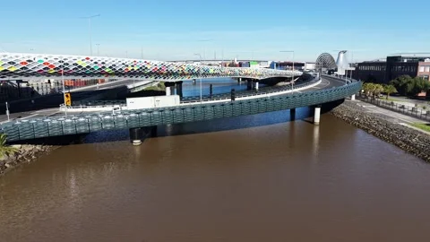 Modern elevated road and pedestrian bridge over a river Stock Footage 340381649