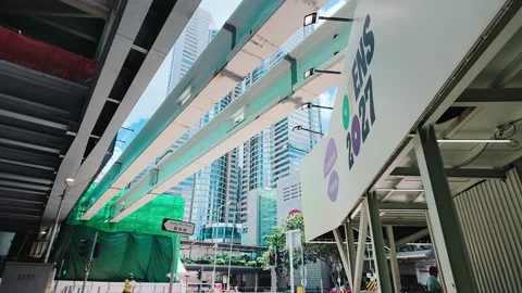 A modern elevated structure with geometric patterns under an overpass in Stock Footage 338165239