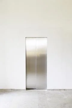 Modern elevator with closed doors extreme closeup detail of a lift in works Fotos de archivo
