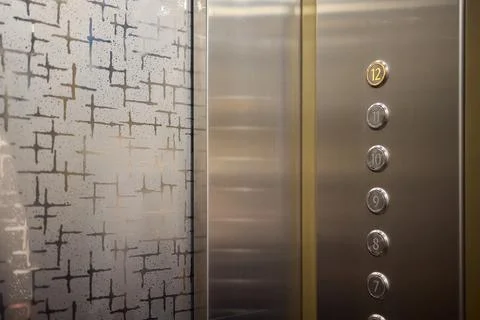 The modern elevator control panel features a display showcasing the current Foto stock