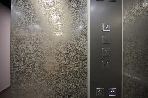 The modern elevator control panel features a display showcasing the current Foto stock