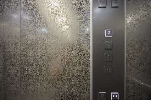 The modern elevator control panel features a display showcasing the current Foto stock
