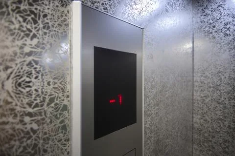 The modern elevator control panel features a display showcasing the current Foto stock