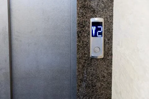 Modern elevator controls seamlessly integrated into a stylish apartment bui.. 写真素材