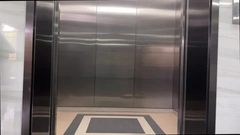 Modern Elevator Doors Opening and Closing Inside Office Building Stock Footage 331910038