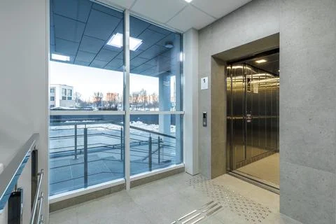 Modern Elevator Hall with Tactile Paving for Visually Impaired Stock Photos