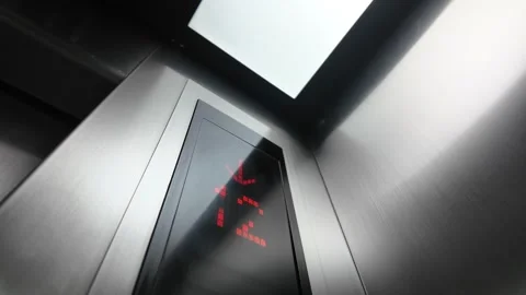 Modern elevator interior with digital floor display showing descent motion. Stock Footage 332626926