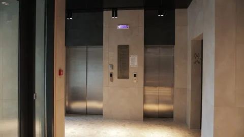 Modern elevator lobby with beige walls Stock Footage 311048470