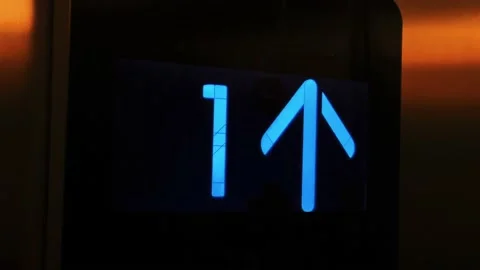 Modern elevator screen showing arrow going up from zero level to number two Stock Footage 223182851
