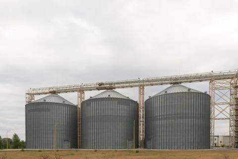 Modern elevator for storing grain against the sky. Grain drying complex, stor Photos