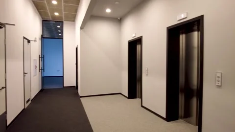 Modern elevators in a business lobby, hotel or store Stock Footage 259864228