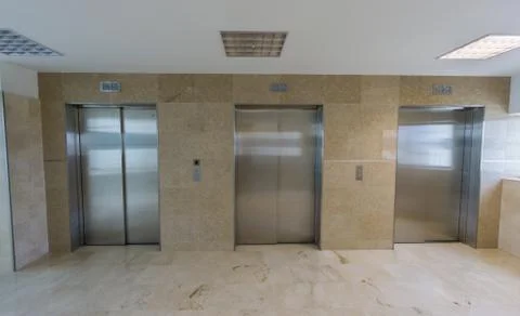 Modern elevators with closed doors Stock Photos