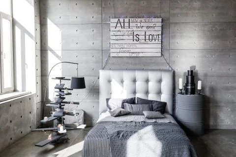 Modern empty bedroom in loft style with grey colors and wooden hand made Stock Photos