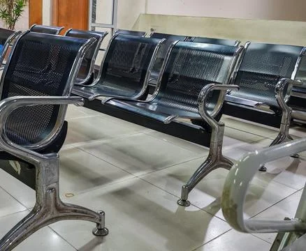 Modern Empty Black Perforated Metal Waiting Room Seating Stock Photos