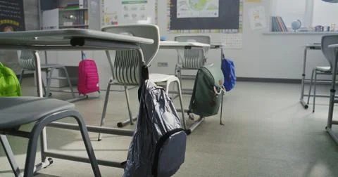 Modern Empty Classroom with Desks, School Supplies for Students, Hanging Stock Photos