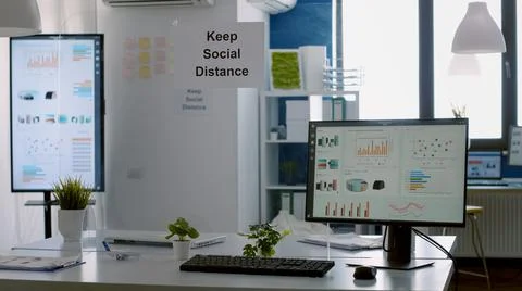 Modern empty office with plastic separators and keep social distance poster Photos