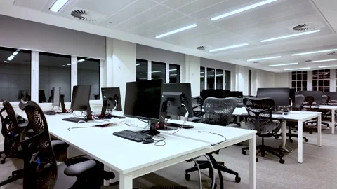 Modern empty office space with computers and chairs, symbolizing remote work Stock Footage 325828988