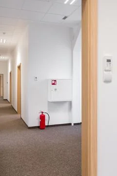 Modern Empty Office Space with Fire Safety Equipment Stock Photos