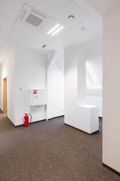 Modern Empty Office Space with Fire Safety Equipment Stock Photos