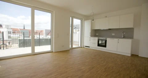 Modern empty studio apartment interior with white kitchen and balcony windows Stockbeeldmateriaal 330065779