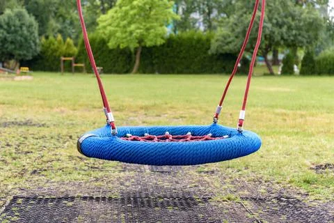 Modern empty swing on the playground Stock Photos
