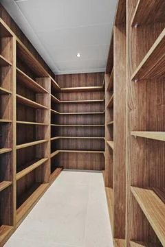 Modern empty walk-in wardrobe interior Stock Photos