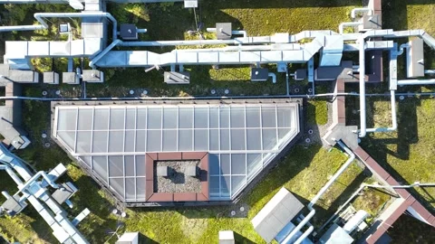 Modern energy-efficient house rooftop showcasing integrated utilities and pipes Stock Footage 330438306