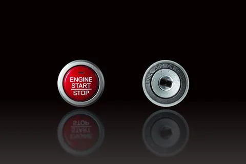 Modern engine start stop button and old style metal keyhole Stock Photos
