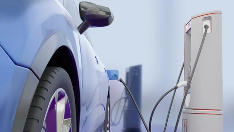 A modern environmentally friendly car is charged from a charging station Stock Footage 202316743