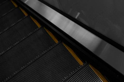 Modern escalator electronic system moving. Escalator is moving up.The ground is Stock Photos
