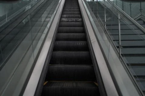 Modern escalator electronic system moving Stock Photos